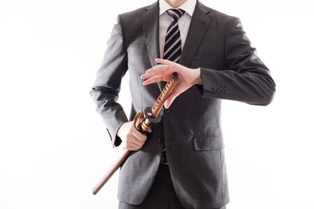 Businessman suit that has a Japanese swordの写真素材