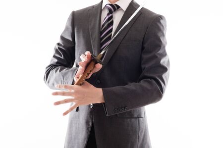 Businessman suit that has a Japanese swordの写真素材