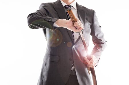 Businessman suit that has a Japanese swordの写真素材