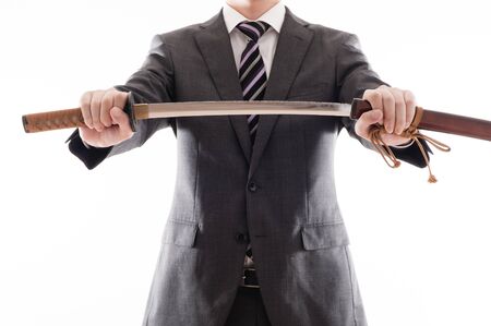 Businessman suit that has a Japanese swordの写真素材