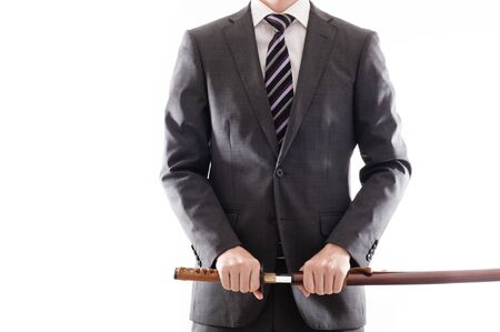 Businessman suit that has a Japanese swordの写真素材
