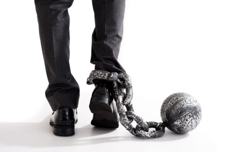 Businessman attached the shacklesの写真素材