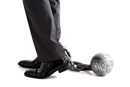 Businessman attached the shacklesの写真素材