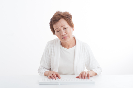 Senior women who are using a PCの写真素材