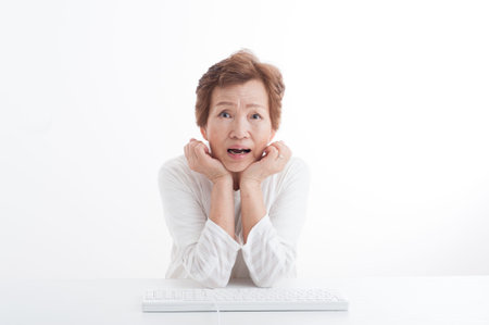 Senior women who are using a PCの写真素材
