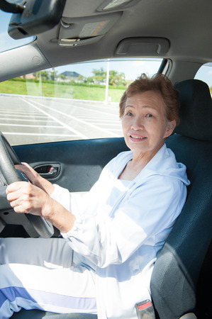 Elderly women who are driving a carの写真素材