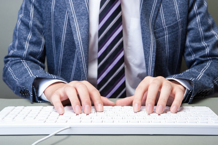 PC keyboard and businessmanの写真素材