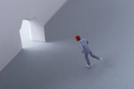 Man running toward the lightの写真素材
