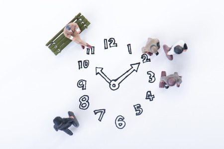 clock and businessmenの写真素材