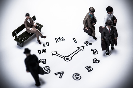 clock and businessmenの写真素材