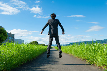 From behind the businessman to jump