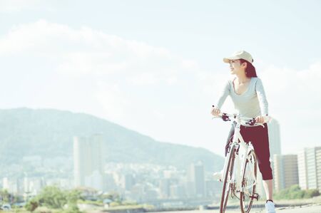 Woman riding a bicycleの写真素材