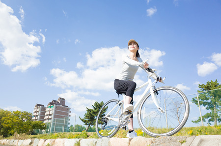 Woman riding a bicycleの写真素材