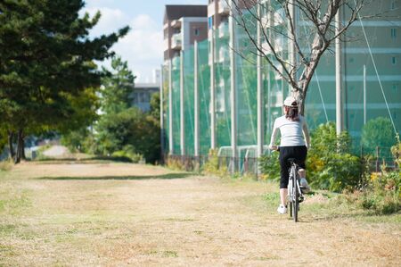 Woman riding a bicycleの写真素材