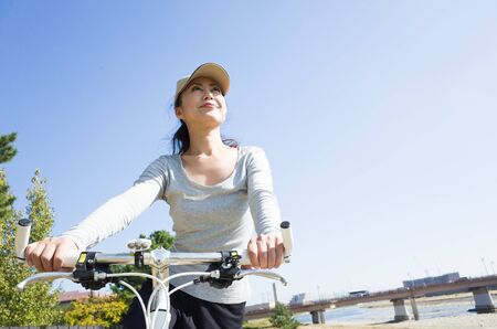 Woman riding a bicycleの写真素材