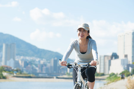 Woman riding a bicycleの写真素材