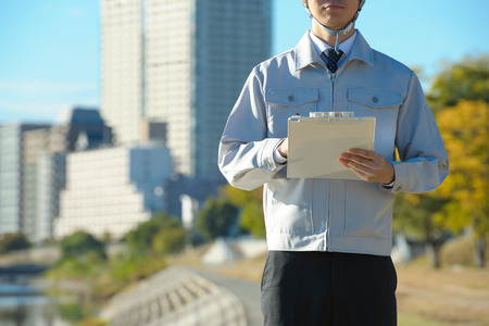 Blue sky and businessman, copy spaceの写真素材
