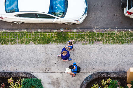 People walking on the sidewalkの写真素材