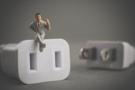 Power cord and businessmanの写真素材