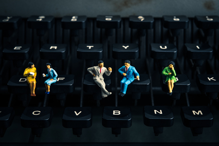 people sitting on the typewriterの写真素材