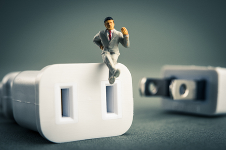 Power cord and businessmanの写真素材