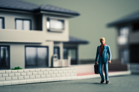 Miniature businessman and residentialの写真素材