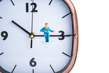 Businessman sitting on the clock