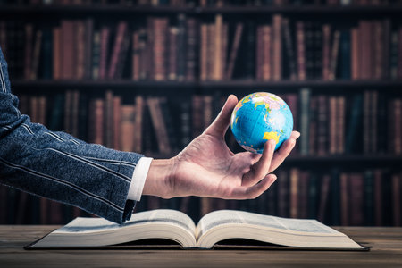 Heavy book and globe