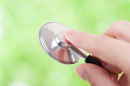 Stethoscope and green backgroundの写真素材