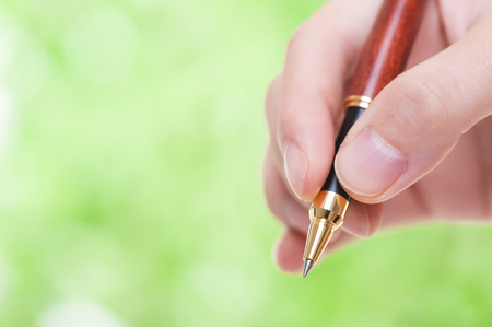 Ballpoint pen green backgroundの写真素材