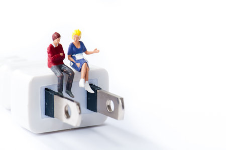 Outlet plug, couples have a conversationの写真素材