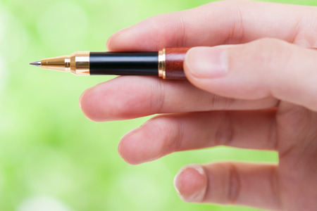 Ballpoint pen green backgroundの写真素材