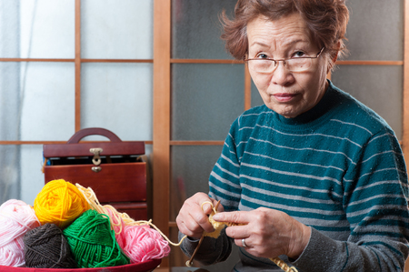 elderly woman with a sewing, Japaneseの写真素材