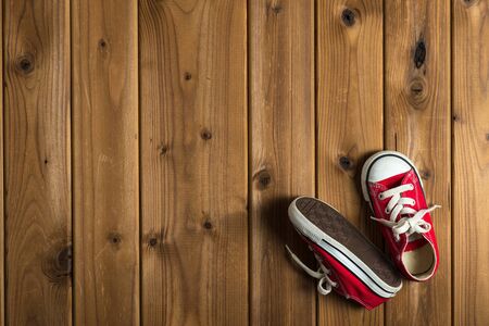 Children's sneakers, woodgrainの写真素材