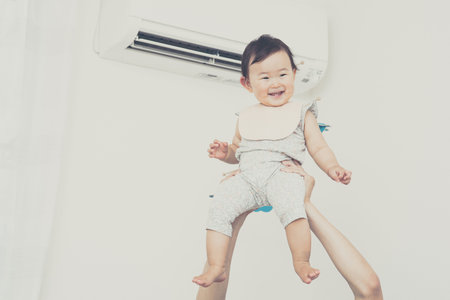 flying cute baby.Japanese Asianの写真素材