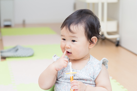 Cute baby brush teethの写真素材