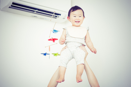 flying cute baby.Japanese Asianの写真素材