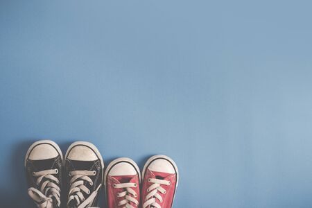 Children's sneakers, Blue backgroundの写真素材