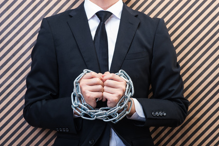 Businessman with chainの写真素材