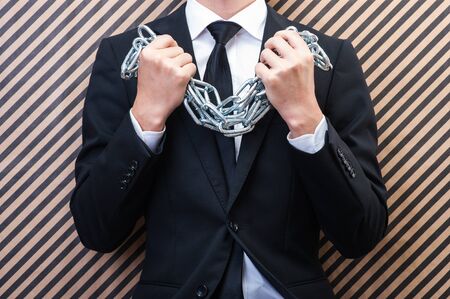 Businessman with chainの写真素材