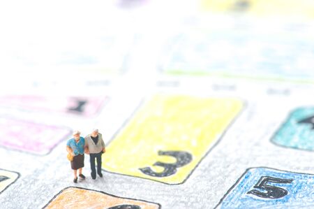 Elderly couple walking on the handwritten mapの写真素材