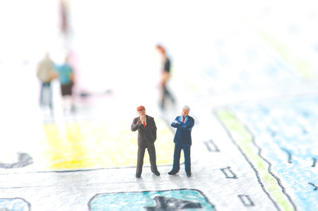 Handwritten map and a miniature businessmenの写真素材