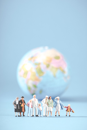 globe and miniature peopleの写真素材