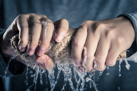 hands of men who squeeze towelの写真素材