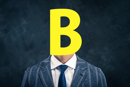 Alphabet face businessmenの写真素材