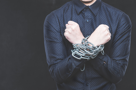 Men were bound with chainsの写真素材