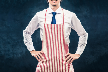 Businessman wearing an apronの写真素材