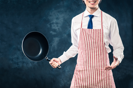 Businessman wearing an apronの写真素材