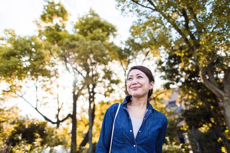 Green background and womenの写真素材