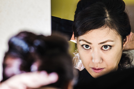 Women who are reflected in the mirrorの写真素材